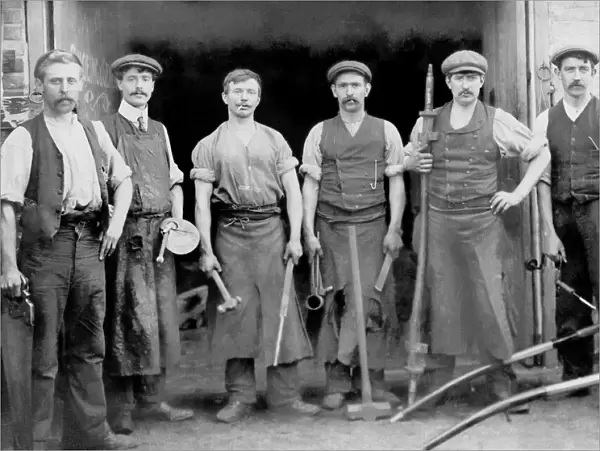 Blacksmiths outside their forge