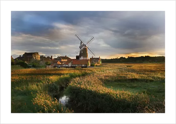 Reedbed and Cley Mill at Cley North Norfolk on a stormy evening in October
