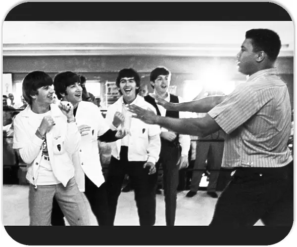 The Beatles (from left: Ringo Starr, John Lennon, George Harrison, and Paul McCartney) clowning with boxer Cassius Clay (later Muhammad Ali) at his training camp in Miami Beach, Florida, 18 February 1964, one week prior to his heavyweight championship fight with Sonny Liston