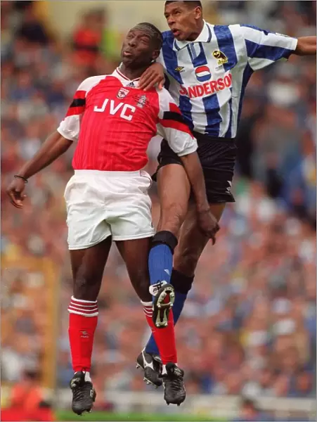 Kevin Campbell (Arsenal) and Carlton Palmer (Sheffield Wednesday)