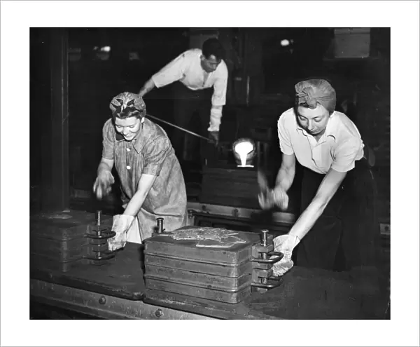 24 year old Joy fletcher and 19 year old Brenda Cawdell at work in the foundry