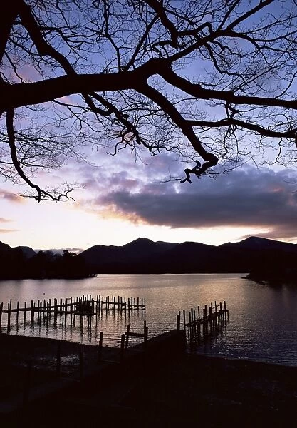 View across Derwent Water from lakeside path at dusk, Keswick, Lake District National Park
