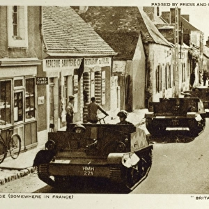 WW2 - British tanks pass through a village