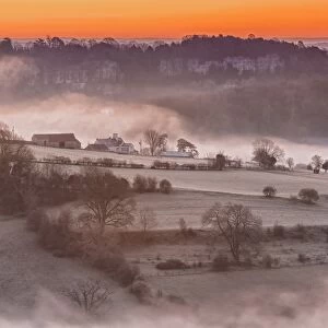 View of farmland and river shrouded in mist at sunrise, Lower Wyndcliff, Chepstow, River Wye, Lower Wye Valley
