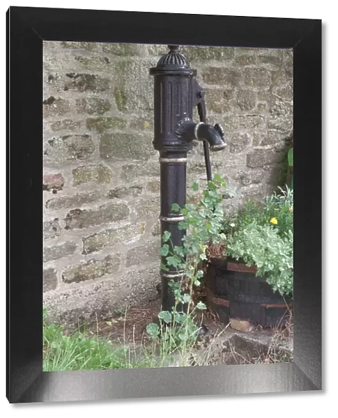 Pump. Mid C19 cast iron pump with a long curved handle and spout. IoE 399999
