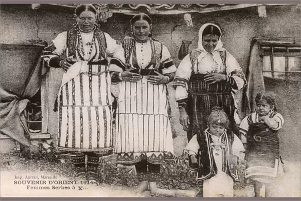 Serbian women and children in traditional costume