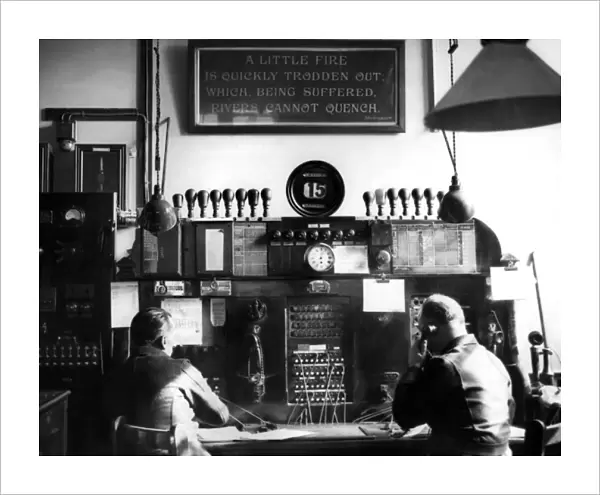 Men working at watchroom telephone switchboard