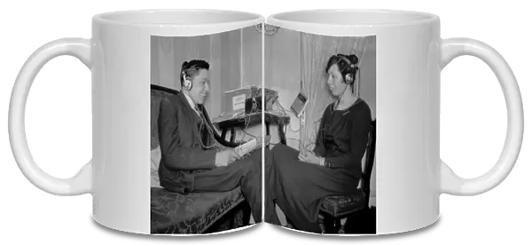 Man and woman with radio equipment