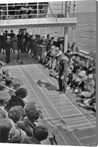 People on ships deck playing a game
