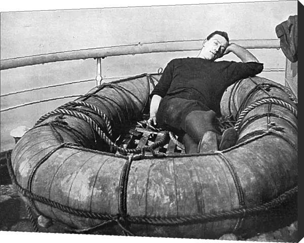 British sailor snoozing on deck, WW1