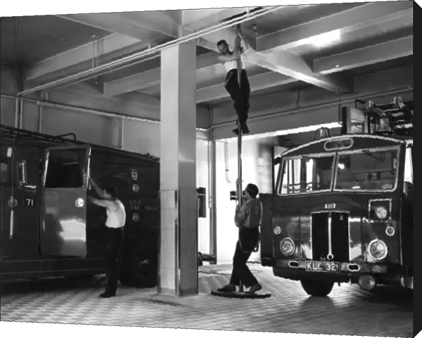 London firefighters sliding down a pole