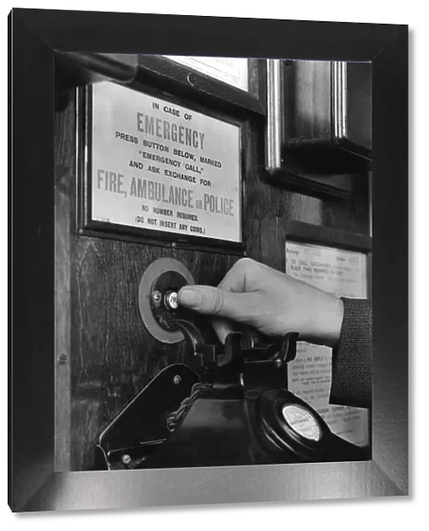 Emergency call button in telephone box