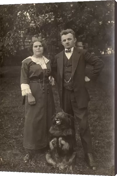 Couple and dog in a garden