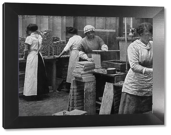 Girls at work making ammunition boxes, WW1