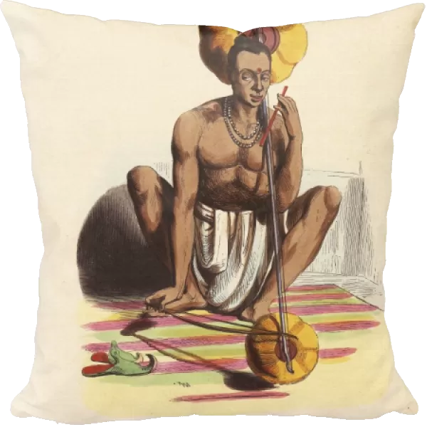 Indian musician in dhoti and necklace playing the pennak