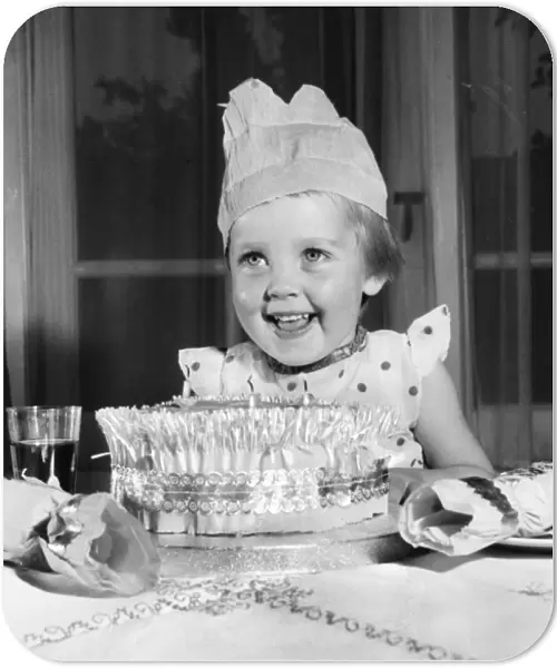 Little girl with Christmas cake