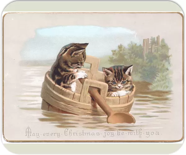 Two kittens in improvised boat on a Christmas card