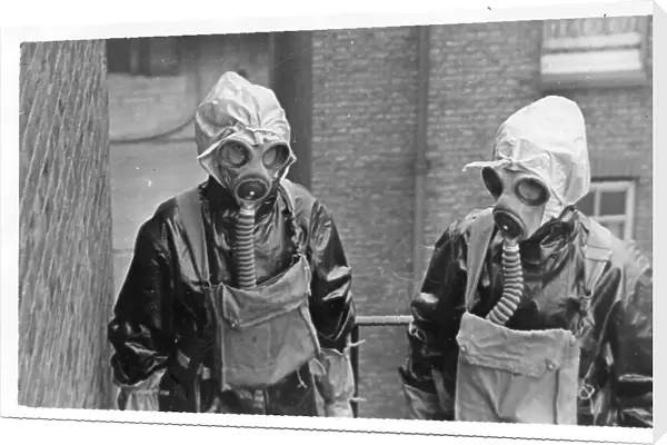 Two women police officers in gas masks, London, WW2