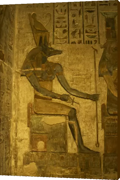 Ptolemaic temple of Hathor and Maat. Anubis. Seated figure