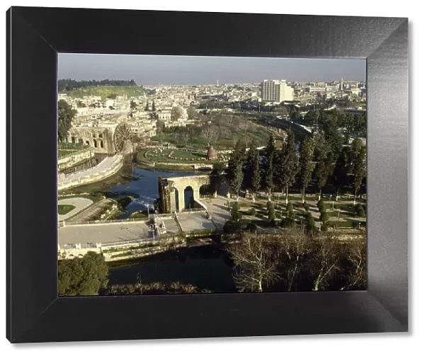 Syria. Hama. General view and the noria in the Orontes river