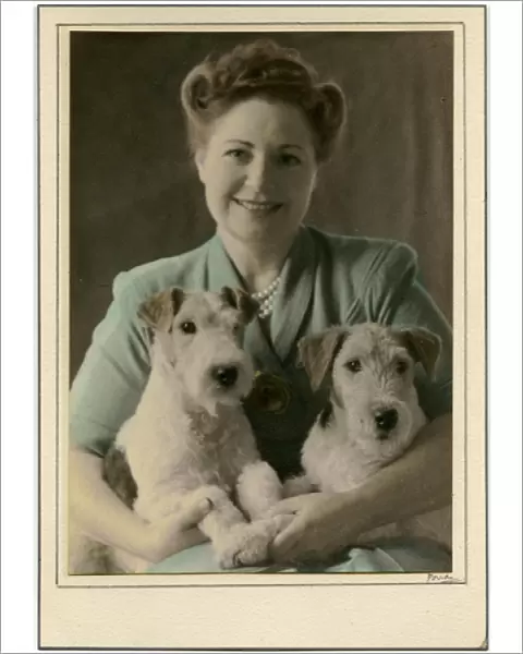 Woman with two Airedale Terrier dogs