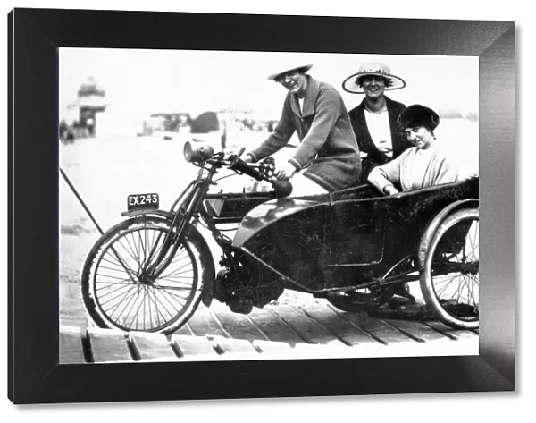 Ladies on a veteran 1910 motorcycle & sidecar