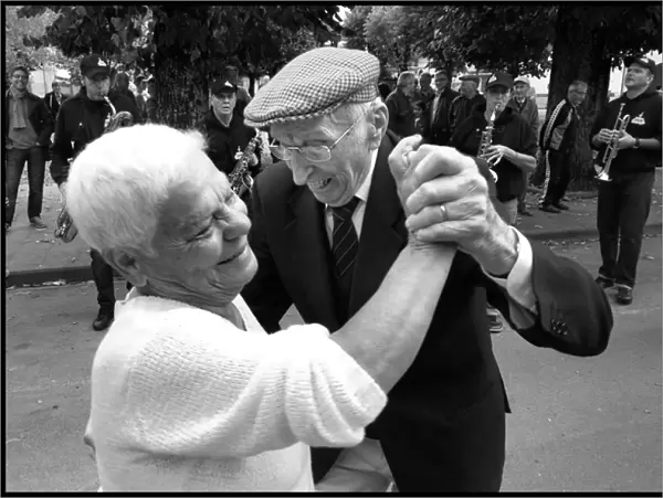 Elderly couple dancing Italy