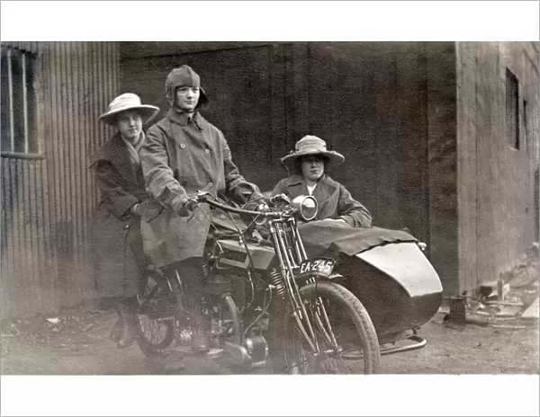 Three people on a 1920 Bradbury motorcycle & sidecar