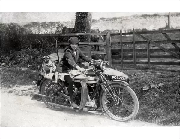 Girl & dog on a 1921 Triumph SD motorcycle & sidecar