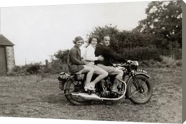 Man & two women on a 1936 BSA motorcycle