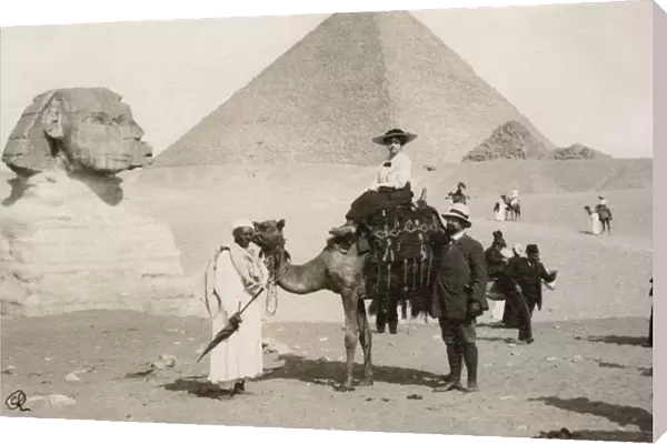Woman riding a camel in Giza, Egypt
