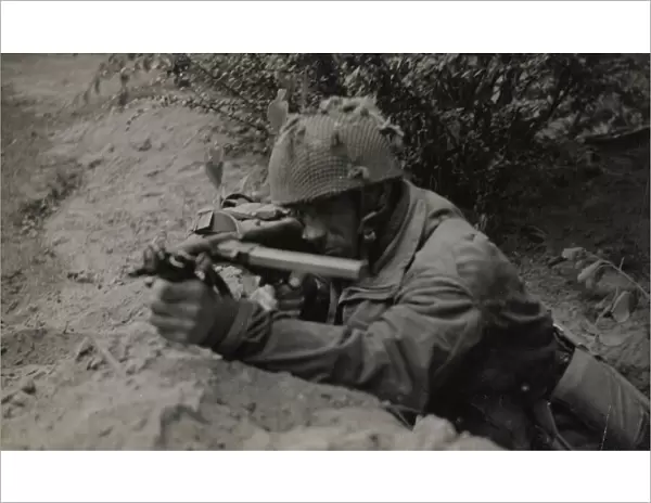Pte J Connington of Selby, Yorks, in action with Sten gun