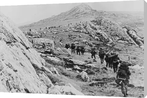 Yomping. Photograph: Yomping. A line of British troops winding up a rocky hillside