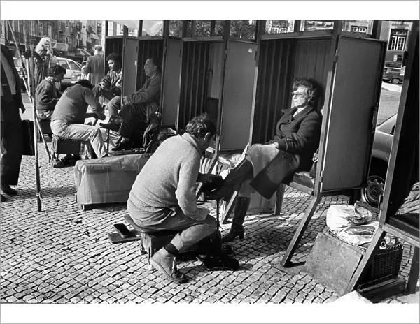 Woman in shoe shine booth Lisbon