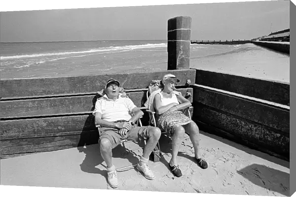 Sleeping pensioners, Norfolk beach