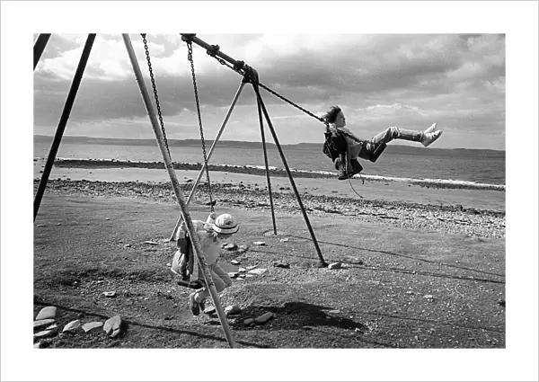 Children on swings, Arran, Scotland