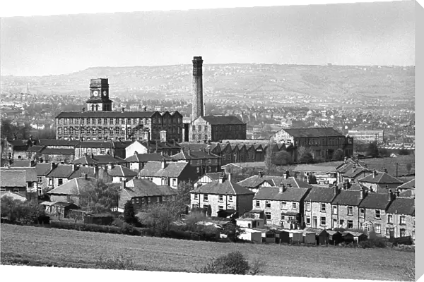 Mill chimney and terraced houses in Huddersfield, Yorkshire