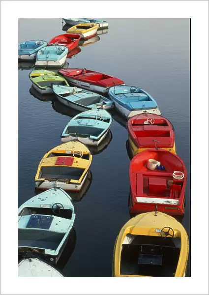 Small colourful boats for hire on the River Dee, Chester