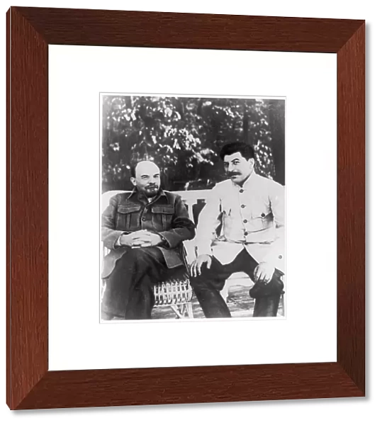 Lenin and Stalin sitting on a bench