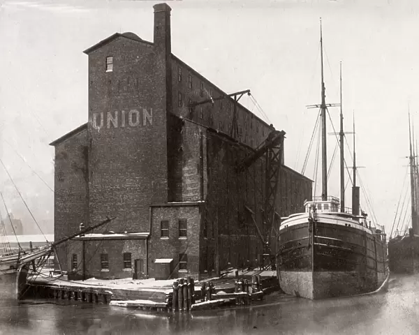 c. 1900s - grain store and ship in dock, Chicago port