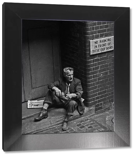 Homeless man in doorway