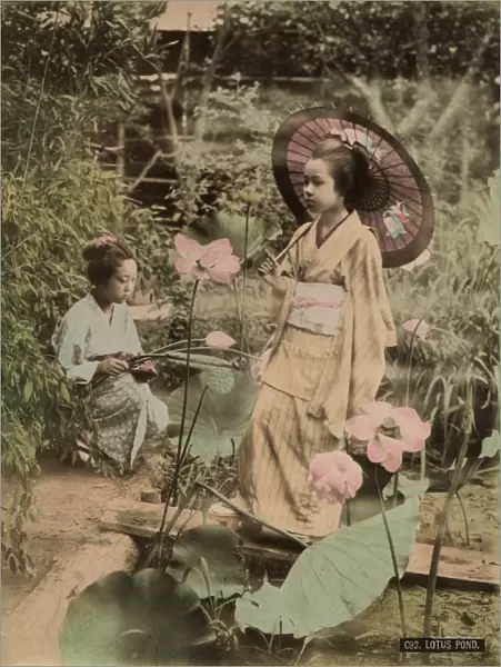 Girls at lotus pond