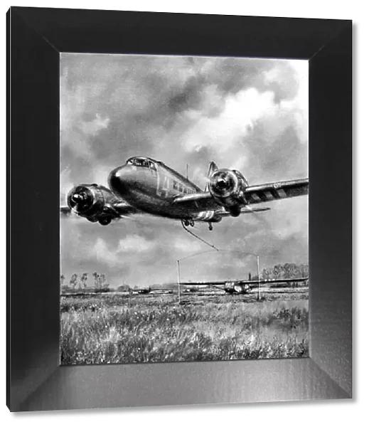 Douglas Dakota picking up a glider, Normandy; Second World W