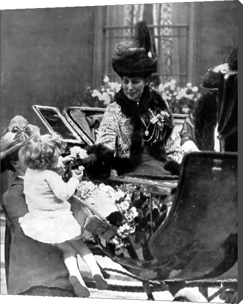 Queen Alexandra receiving a rose from a child, London, 1925