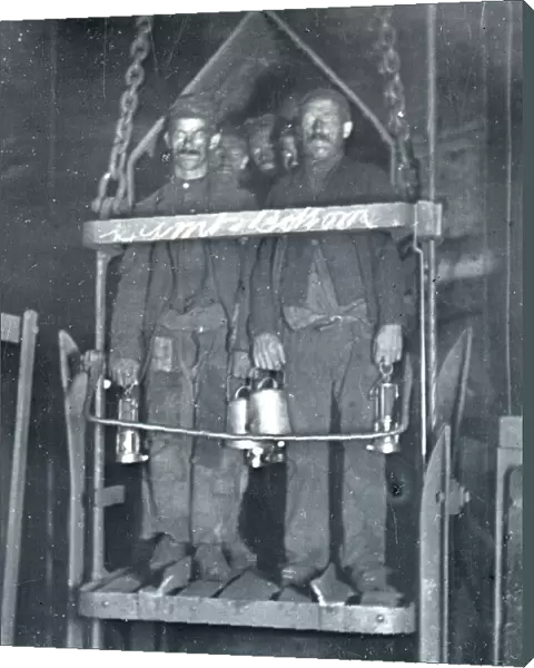 Coal miners in shaft lift, South Wales