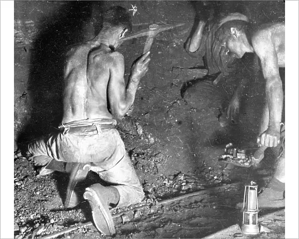Miners working at the coalface, South Wales