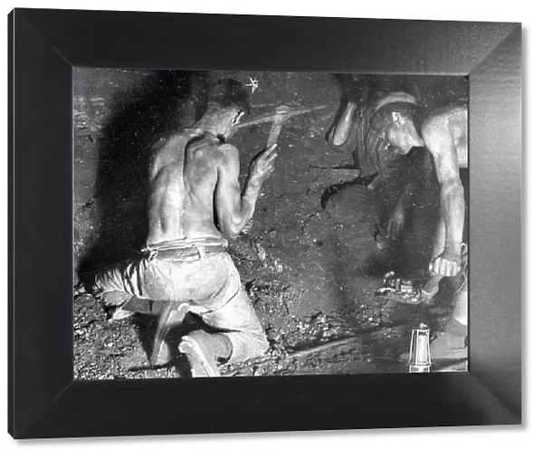 Miners working at the coalface, South Wales