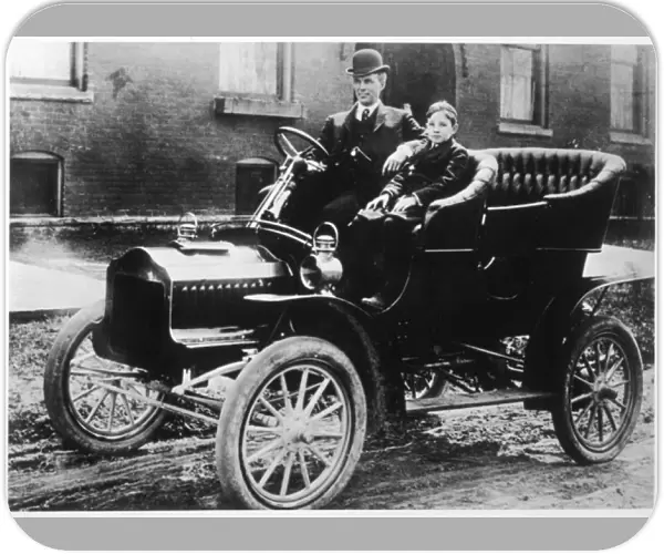 Henry Ford and son Edsel in a 1905 Ford Model F