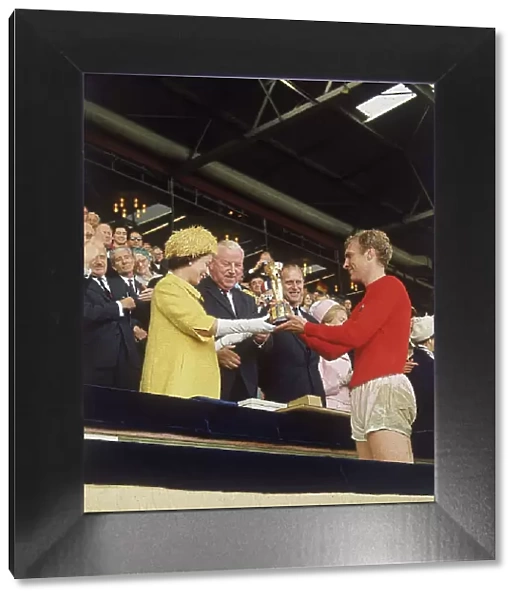 Queen Elizabeth II presents Bobby Moore with World Cup