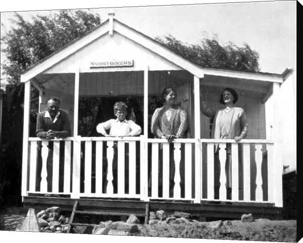People in a typical beach hut or chalet, Walton, Essex